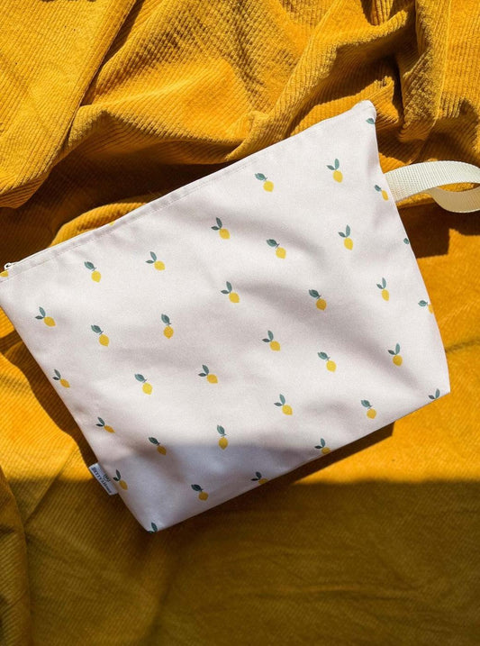Lemon print water-resistant travel pouch made of durable cordura – ideal as a wet swimsuit bag or makeup bag for the beach or everyday use by Hayya